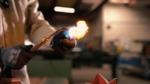 Pipefitter firing up an oxyacetylene torch for brazing