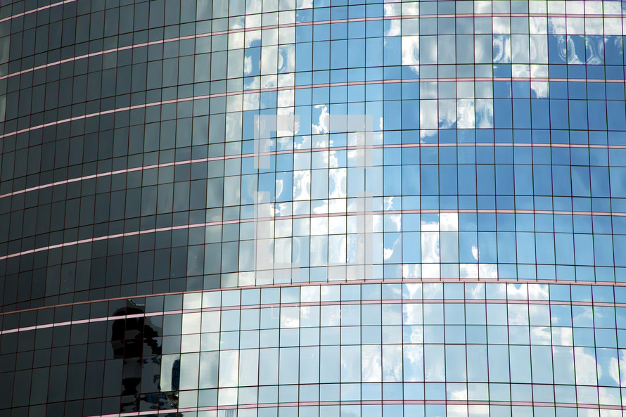 reflection in glass windows on a skyscraper 