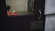 Jesus Christ opens up prison cell door to release a prisoner.