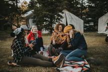 group of women at a campsite 