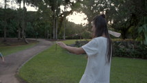 Mother attempts to throw paper airplane to son on family vacation