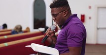 African American Man in Church Preaching Tight Side