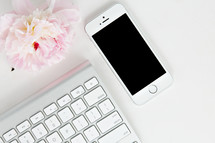 phone, flowers, and computer keyboard 