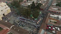 Aerial View Over People Participating In Religious Procession For Semana Santa In Antigua, Guatemala - drone shot