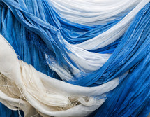 draped blue and white loosely woven fabrics