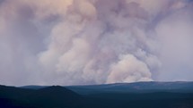 Long lens view of human caused wildfire burning in New Mexico