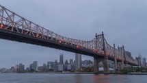Cloudy morning time lapse of the Manhattan Bridge in New York City.