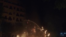 A team of firemans extinguishes festive bonfires
