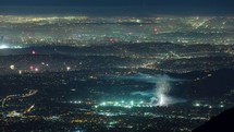 Timelapse of fireworks being set off across a city on the 4th of July as seen from a nearby mountain.  Three comps are offered to provide a variety of views.