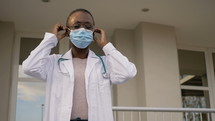 A female healthcare worker wearing a mask