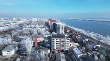 Architectures And White Trees During Winter In Galati City, Romania. aerial sideways shot