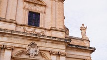 Exterior of a Christian church in Sicily with statues and decorations