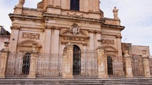 Exterior of a Christian church in Sicily with statues and decorations