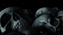 Scary Looking Human Skulls in the Dark with Ashes