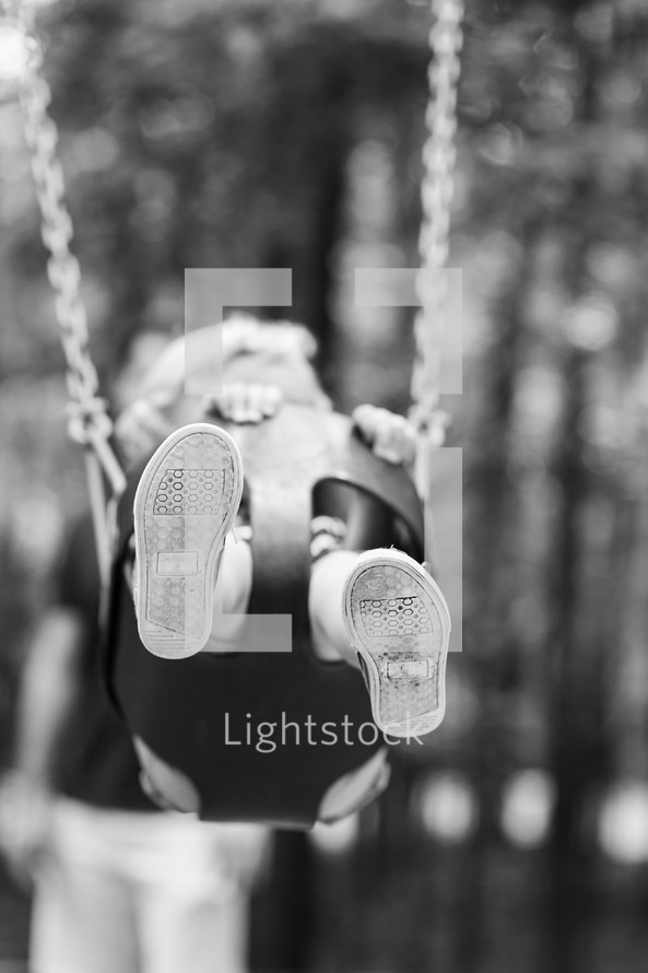 toddler on a swing 