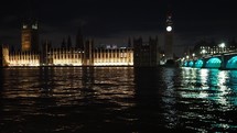Houses of Parliament and Westminster Bridge at night time in London, UK