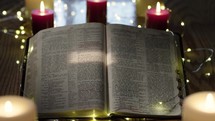 fairy lights, candles, and an open Bible 