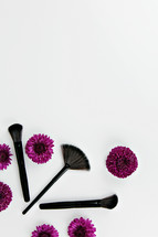 purple mums and makeup brushes 