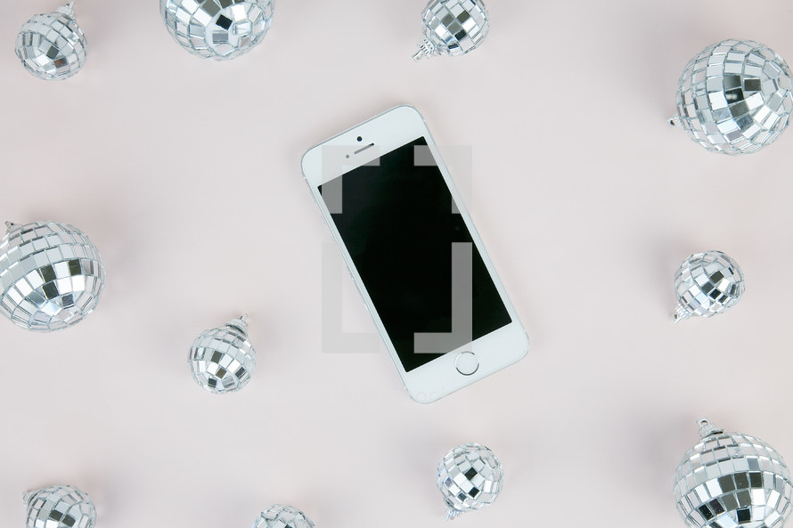 mirrored disco ball ornaments and cellphone 