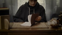 a teen boy reading a BIble 