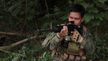 Asian Soldier In Jungle Rifle Up