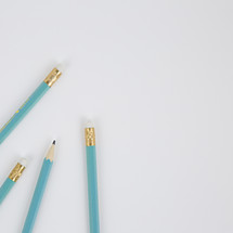 blue pencils on white 