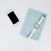 watch, iPhone, and floral planner 