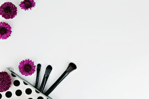 purple mums and makeup brushes