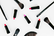 lipstick and makeup brushes 