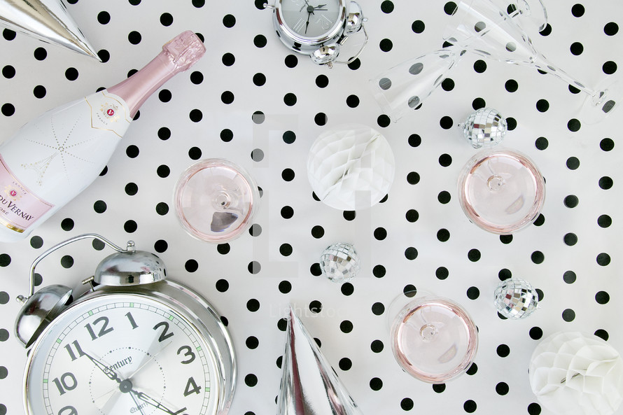 champagne bottle, alarm clock, polka dots, black and white, pink, new years 