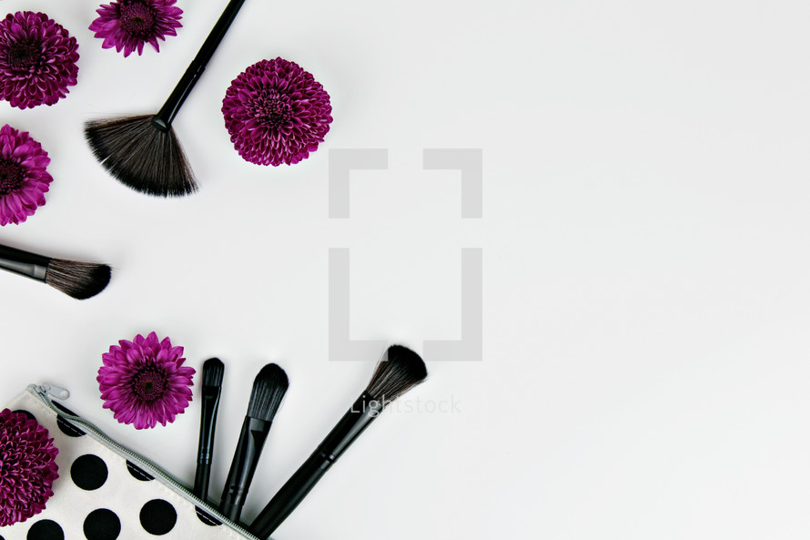purple mums and makeup brushes 