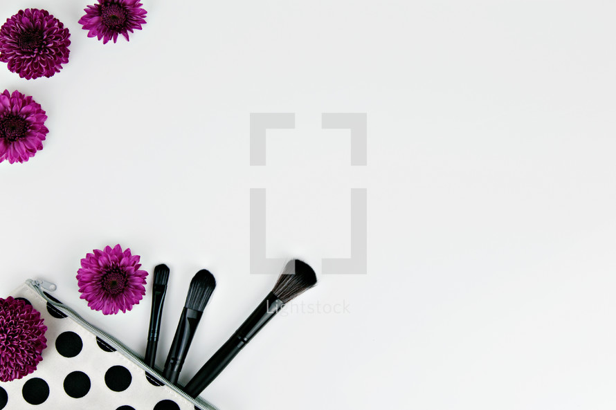 purple mums and makeup brushes