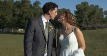 Happy couple, husband and wife, bride and groom kissing on wedding day.