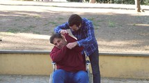 a man in a wheelchair being hit 