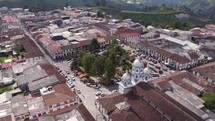 Beautiful park in the centre of small town Filandia in Colombia, aerial orbit