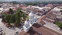 Aerial view behind the tower of the Iglesia María Inmaculada in Filandia, Colombia
