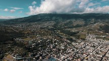 Panorama Of The City Of Otavalo In Ecuador On A Sunny Day. aerial pan left	