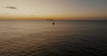 Aerial Drone shot of Sailboat On The Ocean At Sunset In Guanacaste, Costa Rica	