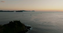 Sailboats On The Serene Ocean Of Costa Rica Tropical Island Near Guanacaste In Central America. Aerial Drone Shot