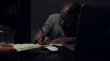 Man studying the Bible at a desk.