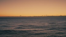 Orange romantic sky sunset and calm ocean