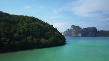 Aerial cinematic drone May Bay Lagoon cliffs 