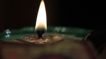 Candle light. Black background.