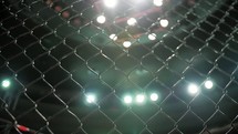 MMA - Cage Close Up with shining lights 