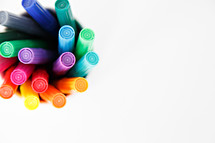 markers in a cup on a white background 