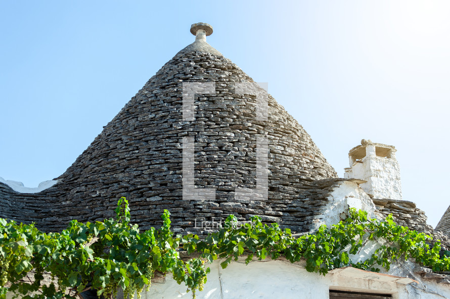 The conical roof of a trullo, a traditional dry stone house, in alberobello, puglia, is a sight to behold