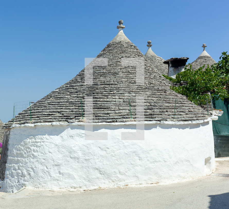 Ancient trulli houses in alberobello, puglia, are characterized by their unique conical roofs made of limestone slabs