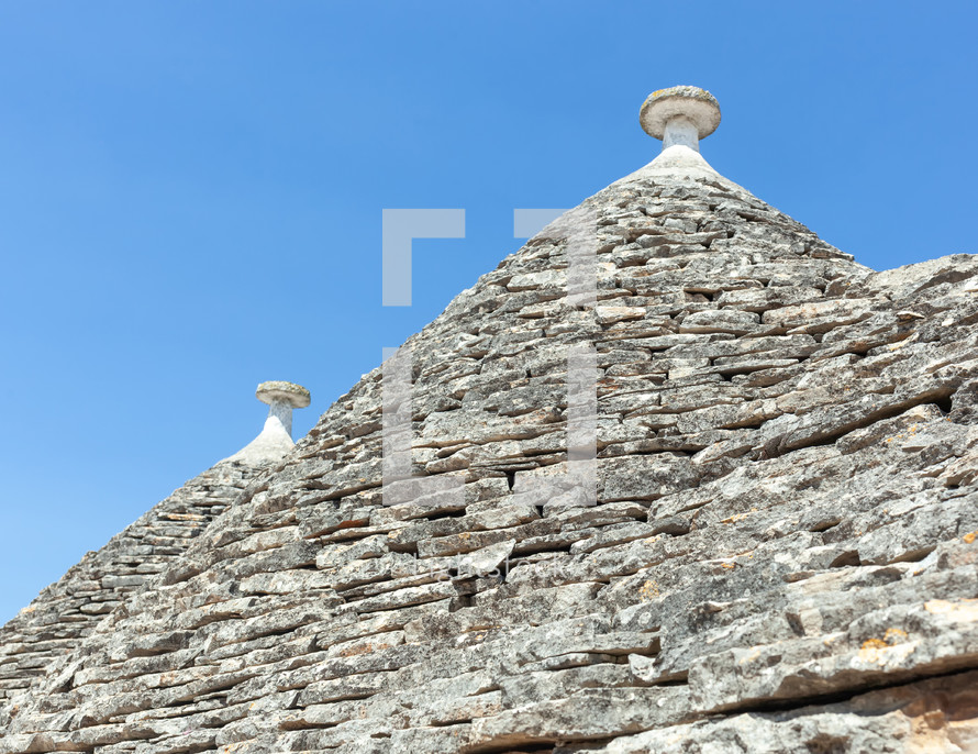 The trulli of alberobello are famous for their conical roofs made of limestone slabs and are a unesco world heritage site