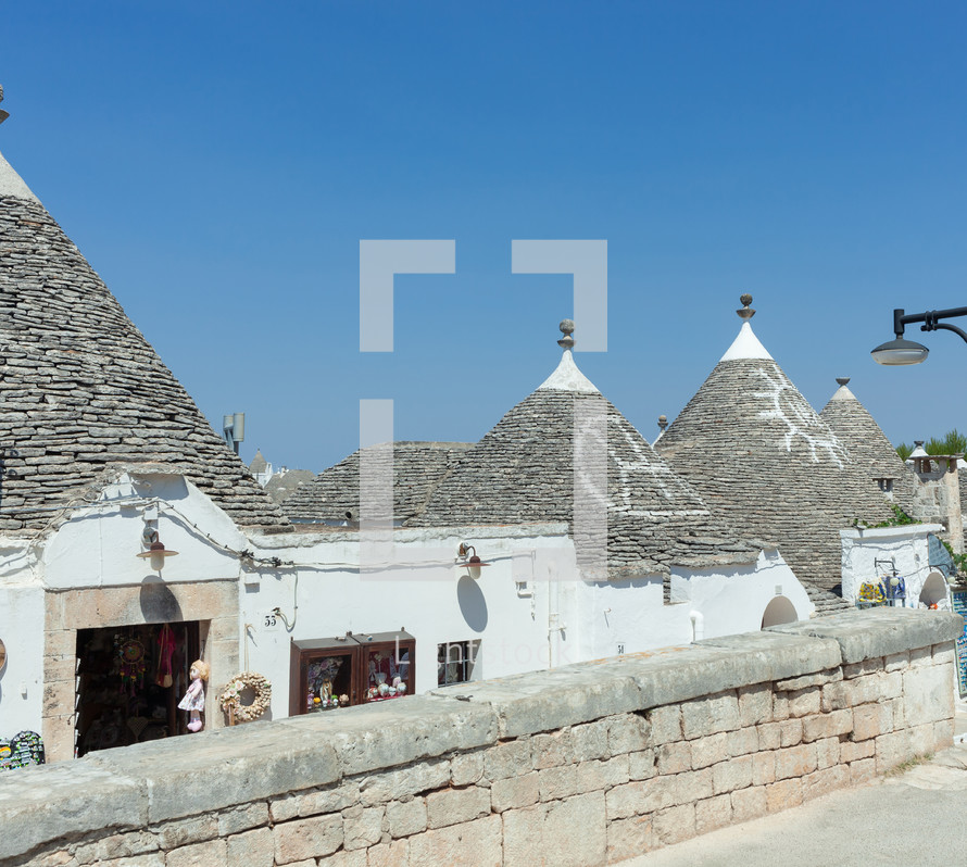 Picturesque view of the trulli, traditional apulian houses in alberobello, with their characteristic conical roofs made of dry stone