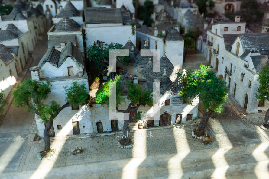 Miniature scale model of alberobello in puglia, italy, representing the village with its typical white trulli houses